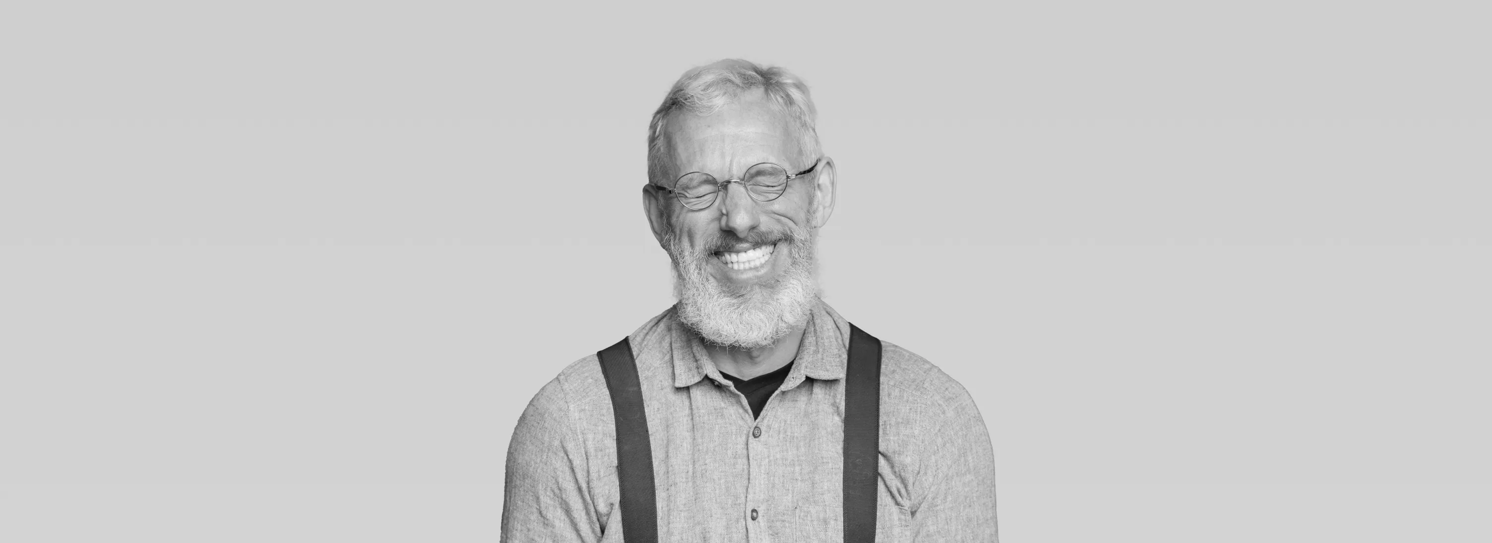 a black and white photo of a man with glasses