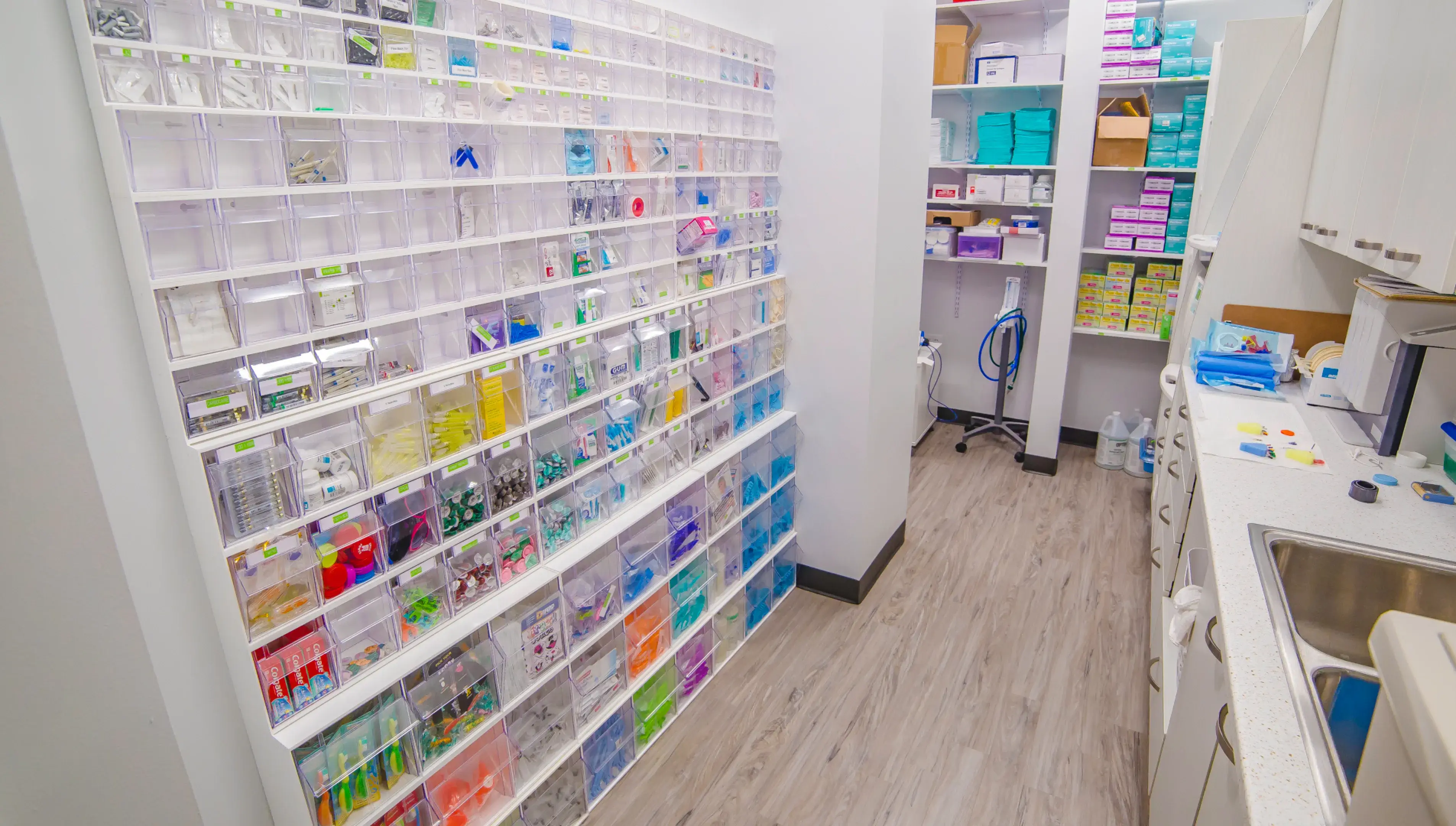 A pharmacy room with shelves full of medical supplies.