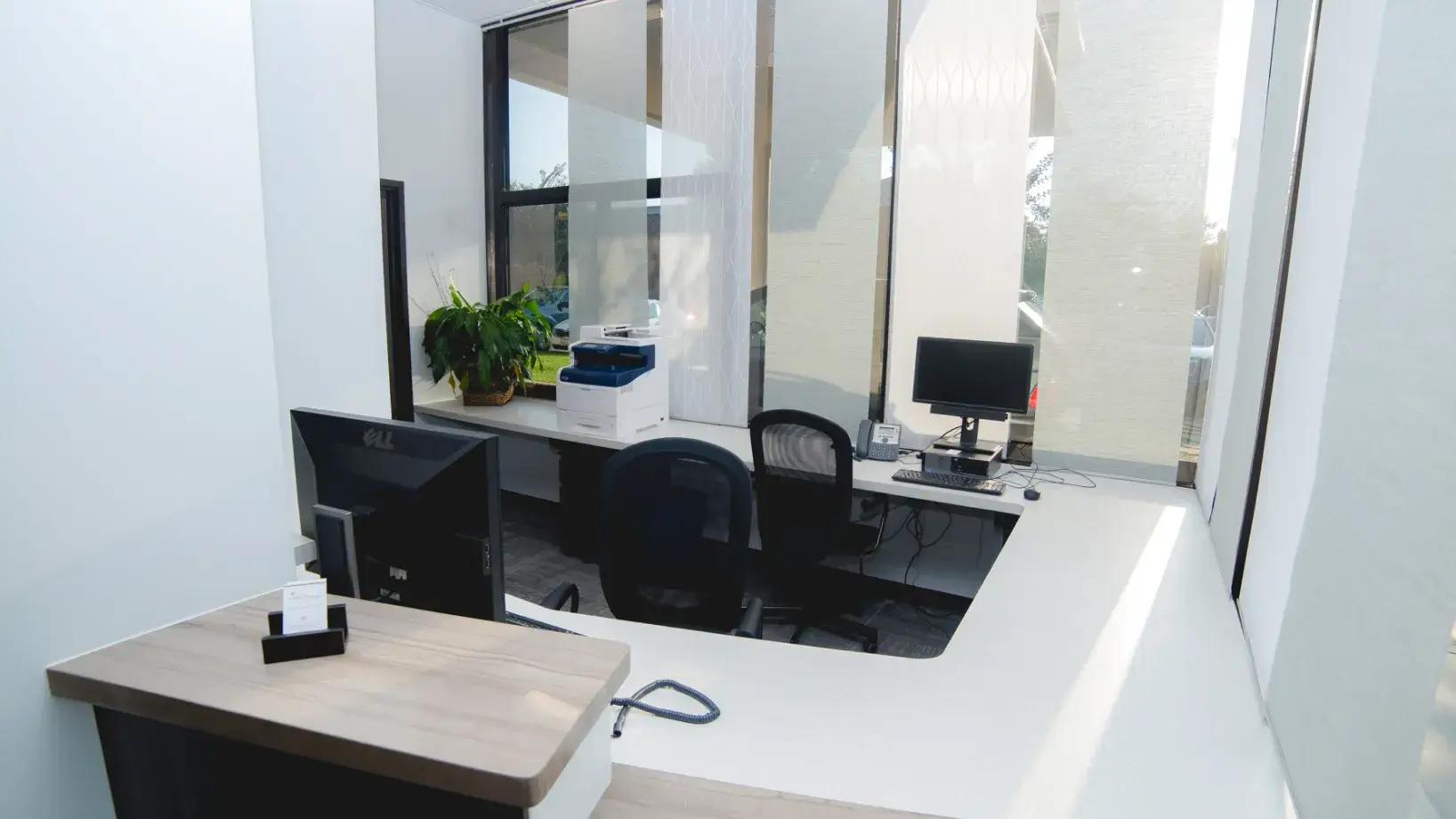 A room with a desk and a computer.