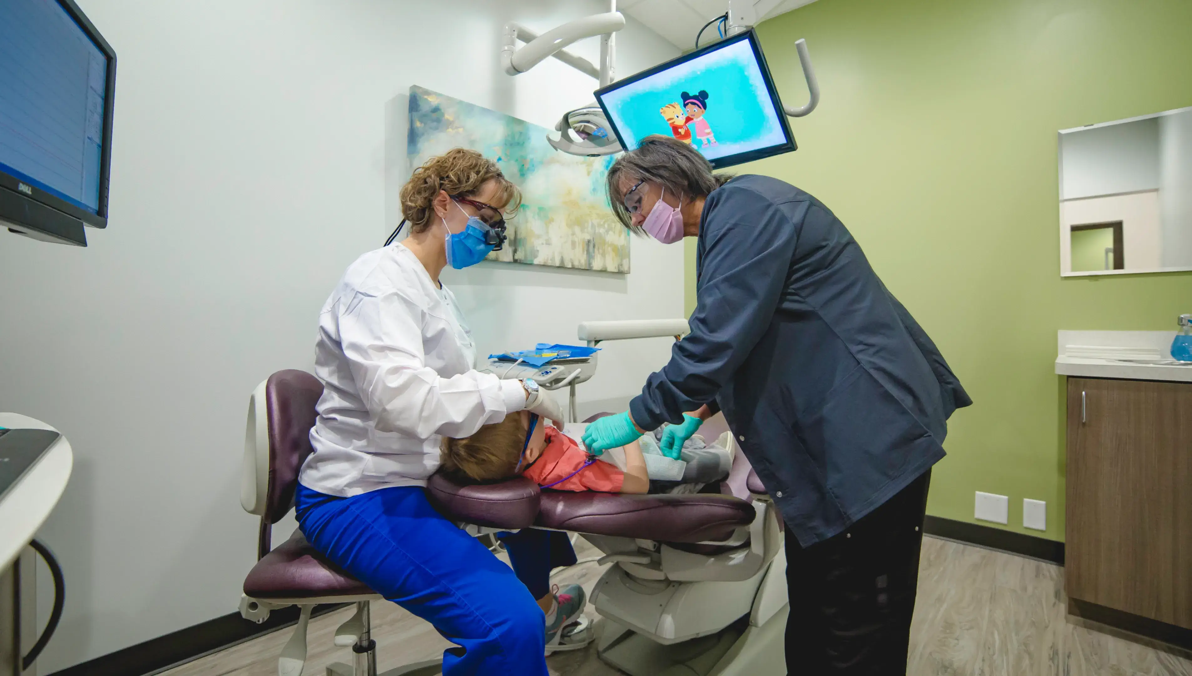 A man and a woman in a dentist's office.
